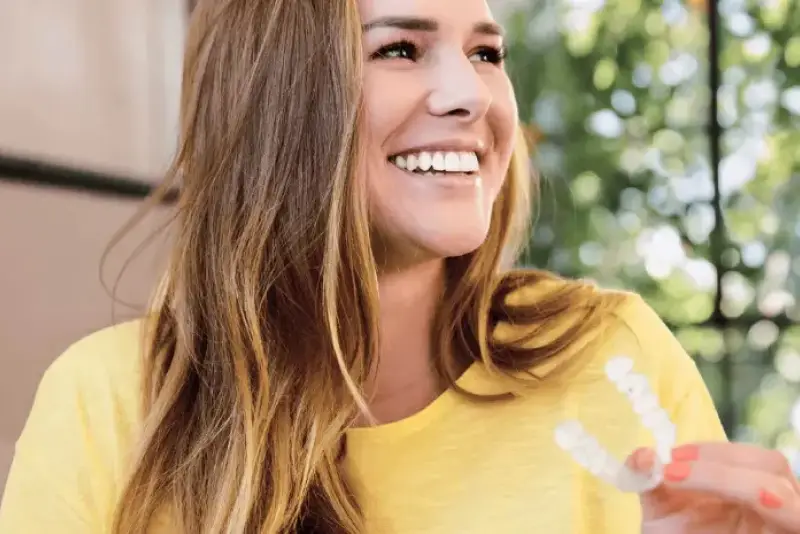 Happy and smiling patient using Invisalign Clear Braces at Cronin Dental, Cork